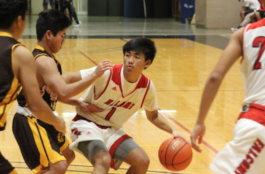 Junior guard Ryan Higashionna looks for an open man against Mililani in the McKinley Boys Basketball Black and Gold Classic 2017 the weekend of Nov. 25. Photo by Noah Tamura 2017.