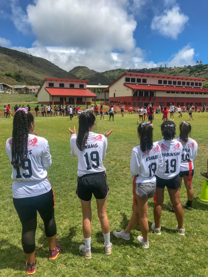 Senior Powder Puff players cheer on their teammates. From left to righ: Kandyce Woods, Ariel Wang, Heidi Kishabi, Jade Robinson, and Daesha Viela. Staff photo 2018. 