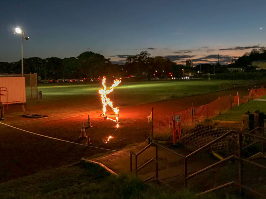 Kalani High Schools Night Pep Rally sees the annual burning of the K on the school track. At the rally, held in the Kalani gym, each class performed a Homecoming dance. The dances were choreographed to songs from the musicals that assigned to each class. After the pep rally, students walked to the track to watch “The Burning of the K”. The students watched the paper K burn from a safe distance as they all sang Kalani’s alma mater. Photo by Tiana Chu 2018.
