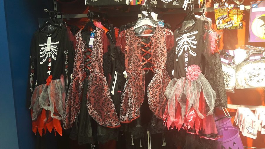 Halloween Costumes hanging on a rack. 