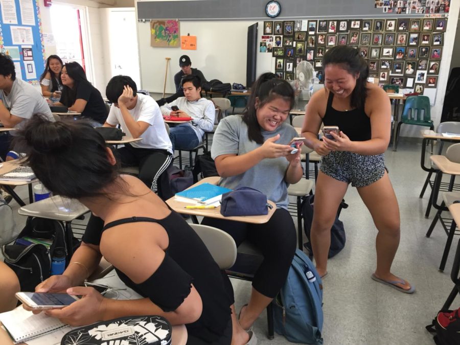 Jazlyn Furuya and Mia Wong play a vocabulary game on Quizlet in Japanese class. School photo 2018. 