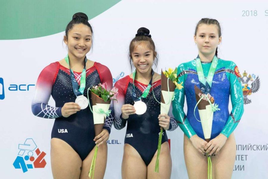 Kayttie Nakamura (center) won a world championship in the double mini-competition at this year’s World Age Group Competition (WAGC) in St. Petersburg, Russia Nov. 11-16. To her right is U.S. teammate Sydney Senter, who placed 2nd in the Double Mini, and to her left is Russian Elizabeta Galtsova, who earned 3rd place. Photo courtesy of K. Nakamura 2018. 