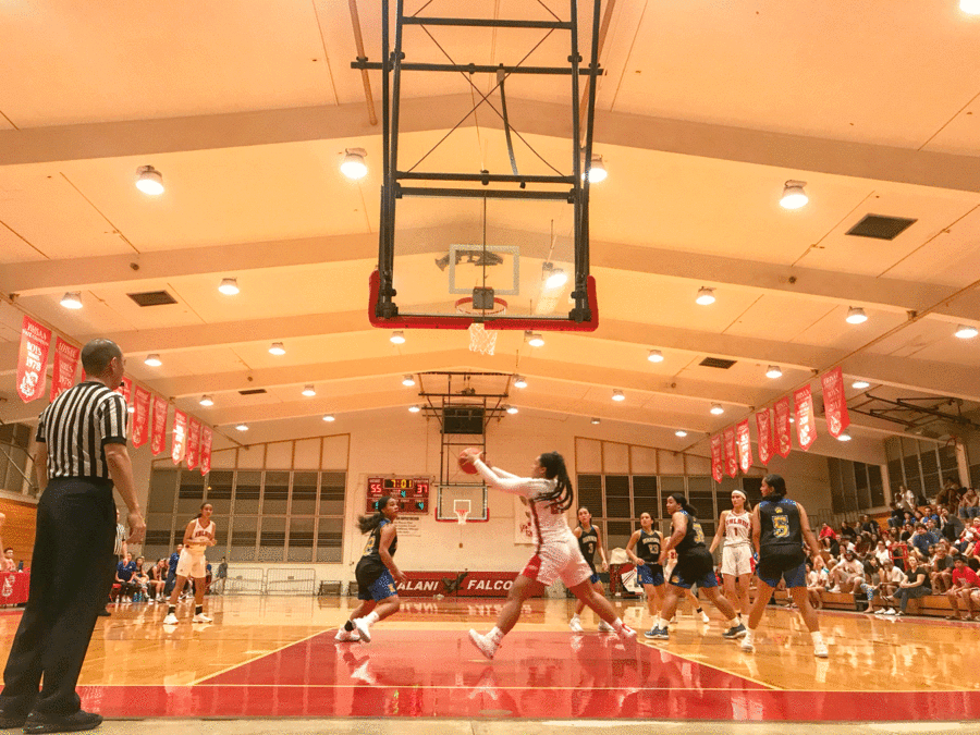 Kandyce Woods (12) lunges for the rebound in Kalanis Dec. 27 game against Kaiser. Woods scored 10 points from inside the paint and Kalani won 82-57. Photo by Serena Wong 2018. 