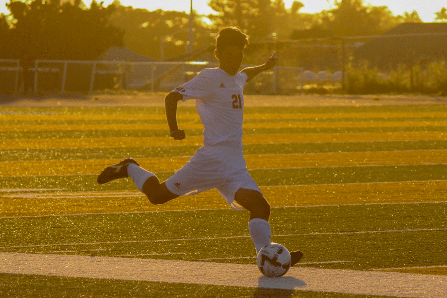 Bryce Oshiro lines up to kick the ball in the first half of Kalanis JV semi-final match against Mililani. He scored the first goal and the Falcons ended up winning 2-1. Photo by Jade Brier 2018.