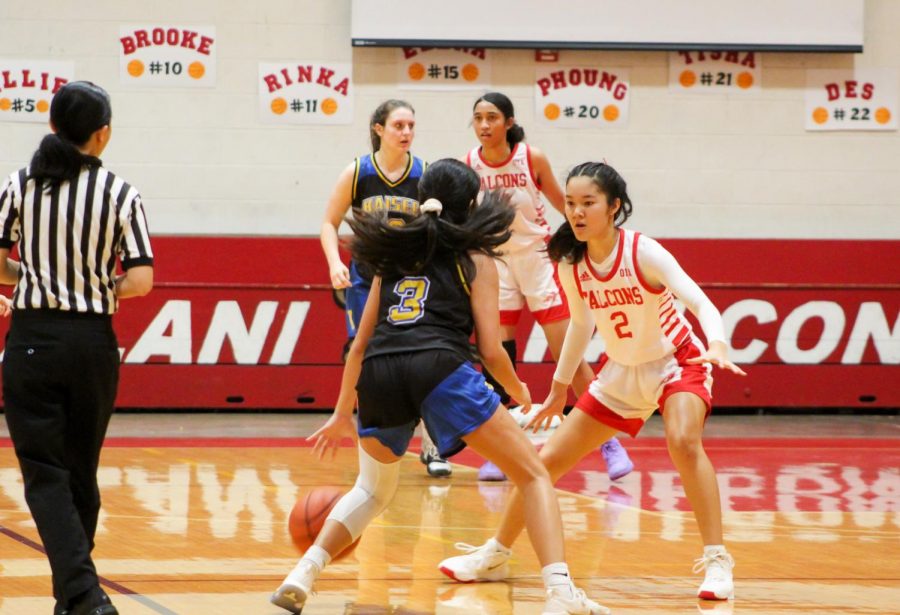 Mandi Haraga (10) posts up against Kaisers point guard, forcing an error that leads to a turnover in the third quarter of their game in the 2020 Girls Basketball season. Kaiser led the whole quarter to finish 43-35 at the third-quarter buzzer. Girls basketball was one of the sports canceled this year due to the COVID-19 pandemic. Photo by Annyssa Troy.