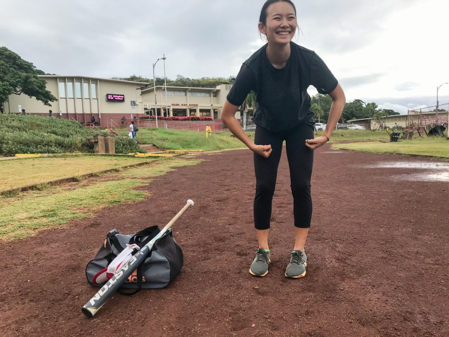 Kady Okamura (11) stretches before a sprint practice in the morning at Kalani High School. As a two-sport athlete, she works out for Track & Field at 6:45 a.m. three days a week, and again after school every day for softball. You can often find her lugging around her bat and gym bag between classes. Photo by Kacie Huang. 