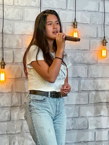Alysa Renacia embraces her emotions and faith in God while singing for the youth group at Grace Bible Church Honolulu. 