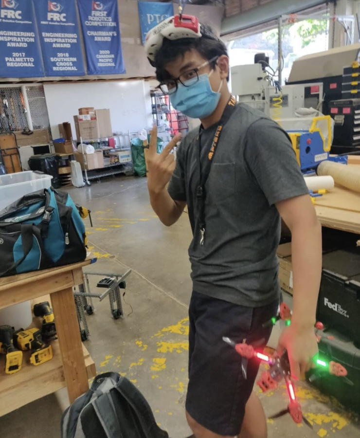 Kiet Pham is getting ready to fly his drone Hyperion in the back of J-Building behind the Robotics and Engineering classroom. The freshman Kalani student restarted and runs the Drones program as part of the Robotics team. 