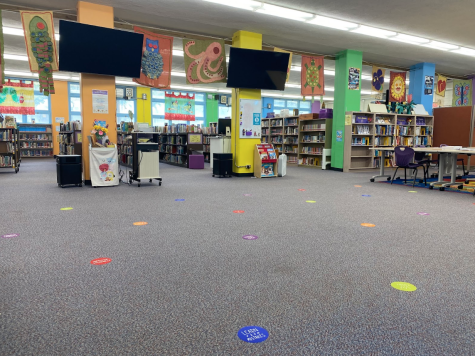 In an effort to keep students safe, Aina Haina Elementary implemented a seating layout in their library. Velcro dots have been placed on the ground to show students where to sit while being socially distanced from each other.  