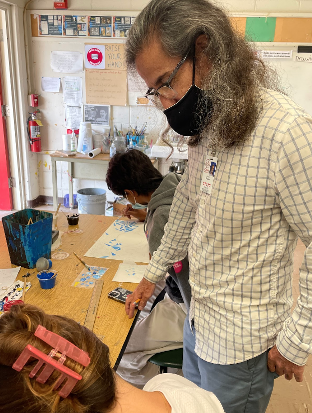 Mr. Mosher gives students individual attention as their work on their art assignments in his Drawing and Painting class. He allows students to be independent, and to work at their own pace. 
