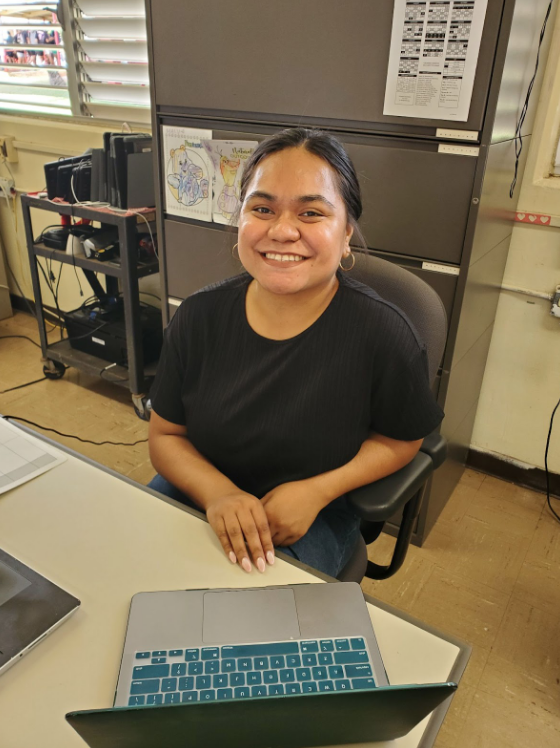 Kilisitina+Finefeuiaki+smiles+from+the+desk+of+her+Special+Education+classroom%2C+located+in+F-11.+She+says+the+hardest+part+of+her+job+is+the+paperwork%2C+which+includes+filling+out+each+student%E2%80%99s+Individualized+Education+Program+%28IEP%29.+However%2C+her+favorite+part+of+the+job%E2%80%94working+with+the+kids%E2%80%94is+what+makes+it+all+worth+it.
