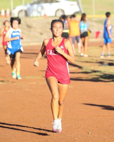 Leilani Phan (10) sprints to the finish line at the Michael Doran Invitational cross country meet at Kalani High School on Saturday, Oct. 1. Phan is sophomore on the varsity team after competing at the XC State Championships on the Big Island in 2021 as a freshman. 