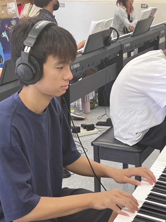 Eric Chan (10) works on his Christmas Recital during his Period 6 Piano class. 