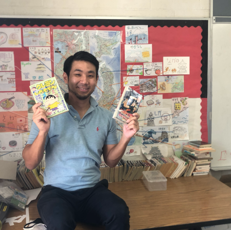 Mr. Masuda, one of Kalani High Schools Japanese teachers holds up manga in front of a board with Japan’s prefectures in room C26. In class, students learn about the language and the culture. 