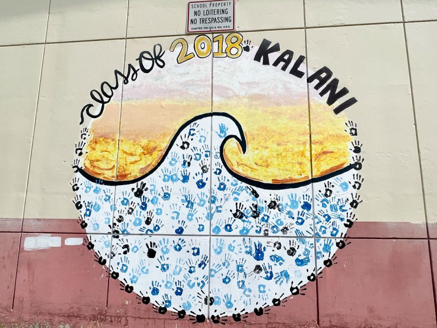 Kalani’s D building mural was painted for the Class of 2018. Handprints of some students from that class are placed on and around it with a beachs golden sand and blue ocean wave. This mural is a representation of Kalani’s strong sense of community and artistic talent. The detail and shading shows the effort and care of the students. And the handprints left behind display their sense of belonging to this school.