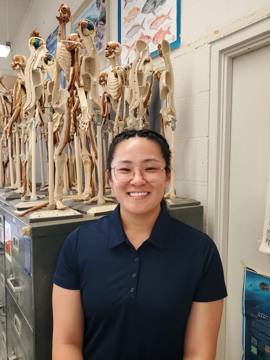 Zoe Tateyama poses in her new science classroom in room E-28. As a Kalani alumnus and judo coach, Tateyama is excited to enter this new phase in her educational career.