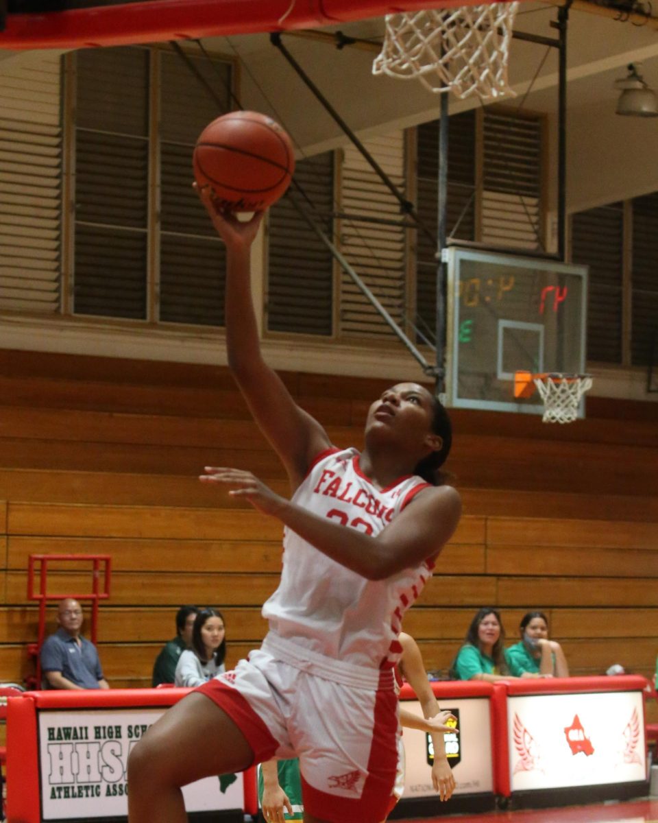 In a display of her "fierce" competitive nature, Alina Stephenson (12) goes up for a layup during a home game at Kalani High School. Basketball has been Stephenson’s longest commitment, a sport she pursued because of her father’s influence and her desire to play at a high level.