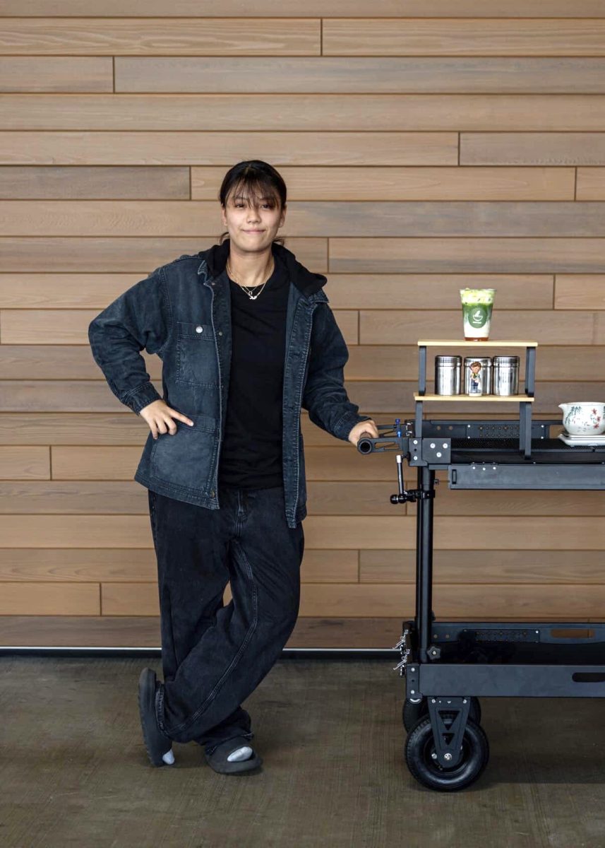 Former Kalani valedictorian Jinie Ho stands with her custom matcha cart, which she launched in July 2025 following a trip to Japan. Although she originally intended the pop-up to be a summer activity with friends before college, the business went viral. Despite the long hours and moments of burnout, Ho says the experience helped her find a better balance between her education, family, personal life, and future career goals.