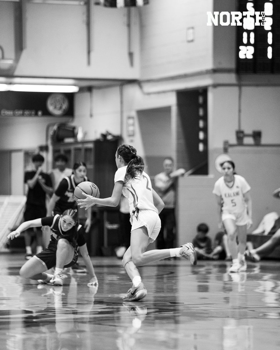 Kalani guard Jordin Baker (9) drives down the court during a tense game against Moanalua on Jan. 16. Baker scored 23 points and was named player of the game by OC16. The game ended in a 49-46 victory for Kalani.