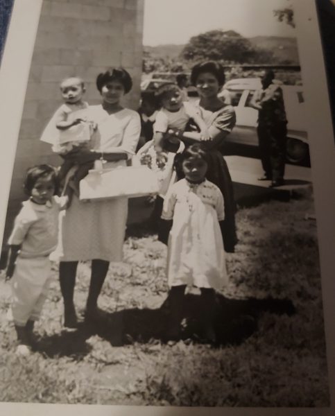 An old photograph of my grandma Lilia, my two aunties: Josie and Lorna, my grandma’s sister, and her two kids. Taken after they had only recently moved to the United States. 